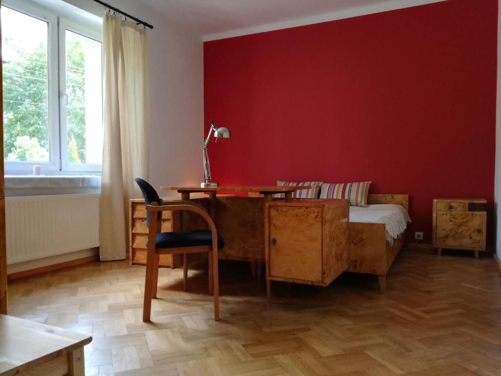 Red wall room with desk
